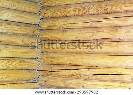 the inner a log cabin corner of the house is built from wooden logs and entwined rope as a background