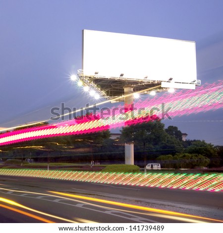 Billboard at night light trails