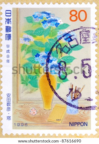 JAPAN - CIRCA 1996: A stamp printed in japan shows Vases and books, circa 1996