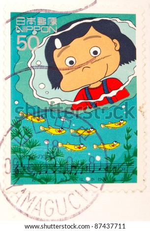 JAPAN - CIRCA 2000: A stamp printed in japan shows Girl goldfish and read music, circa 2000