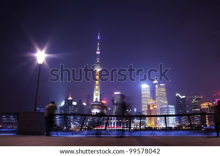Shanghai night skyline and visitors