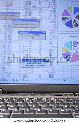 laptop computer screen showing a spreadsheet with several error messages