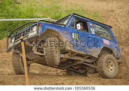 MOHELNICE, CZECH REPUBLIC - JUNE 10. Unidentified racer at blue off-road car on a steep slope in the \