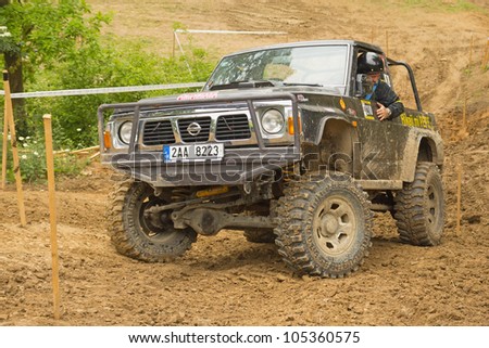 MOHELNICE, CZECH REPUBLIC - JUNE 10. Unidentified racer at off-road car in difficult muddy terrain in the 