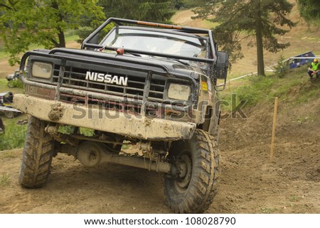 MOHELNICE, CZECH REPUBLIC - JUNE 10. Unidentified racer at off-road car on a steep slope in the \