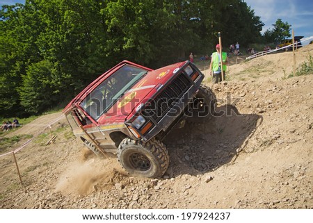 MOHELNICE,  CZECH REPUBLIC - JUNE 07: Red offroad car is in lateral tilt. \