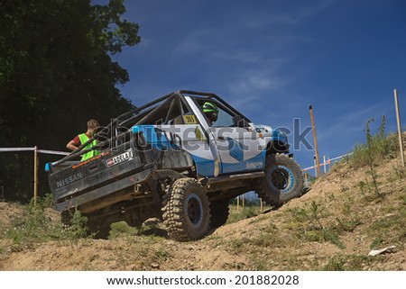 MOHELNICE,  CZECH REPUBLIC - JUNE 07: Off-road car is hitting a steep hill in the \