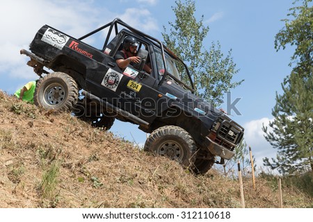 MESTECKO TRNAVKA,  CZECH REPUBLIC - AUG 29: Black off road car is sliding down a steep slope in defined route at \