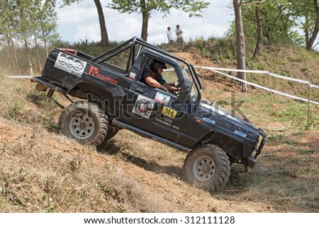 MESTECKO TRNAVKA,  CZECH REPUBLIC - AUG 29: Black off road car successfully rolled off difficult terrain at \