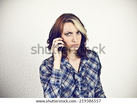 Angry girl at smart phone