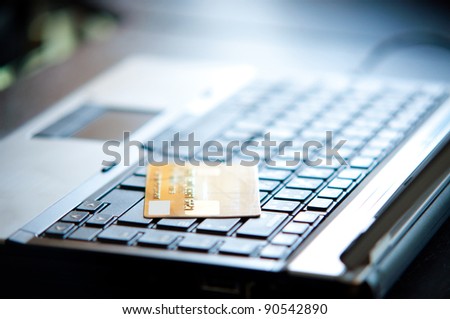 credit card on laptop for online shopping concept