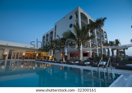 Florida beach vacation hotel with reflecting swimming pool