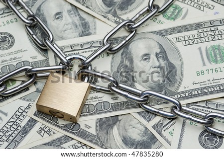 Safe secure chain locked stack of hundred dollar bills