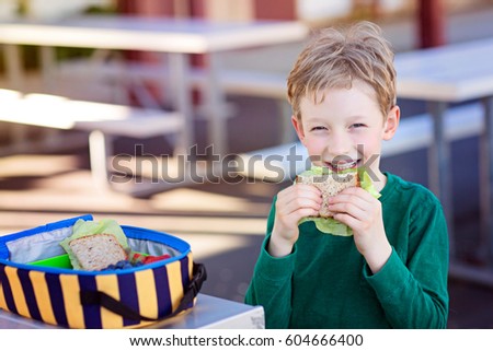 Similar – Image, Stock Photo Child eats sandwich outdoor