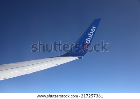 MIDDLE EAST - MAY 26: Wing of the FlyDubai airplane during a flight. May 26, 2011 in the Middle East