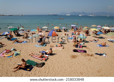 CANNES, FRANCE - JULY 2: Crowded beach in mediterranean resort Cannes. July 2, 2008 in Cannes, Provence-Alpes-Cote d\'Azur, France