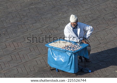 MARRAKESH, MOROCCO - NOV 20: The tooth man of Marrakesh offering his service at the Jamaa el Fna square. November 20, 2008 in Marrakesh, Morocco
