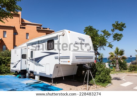 MANILVA, SPAIN - JUNE 21: Semi trailer caravan on the camping site in La Bella Vista in Spain. June 21, 2014 in Manilva, Andalusia, Spain