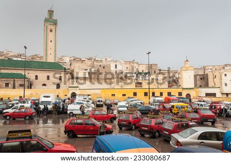 FEZ, MOROCCO - DEC 1: Square with red petit taxis in the medina of Fez. December 01, 2008 in Fez, Morocco, Africa