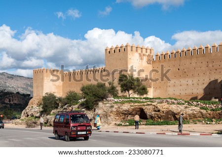 FEZ, MOROCCO - DEC 2: Street and the ancient fortified wall in Fez. December 2, 2008 in Fez, Morocco, Africa