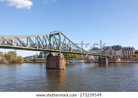 FRANKFURT MAIN, GERMANY - APR 18: The Eiserne Steg - old iron bridge over the river Main in Frankfurt. April 18, 2015 in Frankfurt Main, Germany