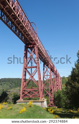 Historic iron railway arch bridge - The Garabit Viaduct - through the River Truyere was built 1884 by the famous french engineer Gustave Eiffel