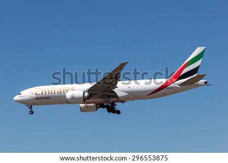 FRANKFURT MAIN - JULY 10: Boeing 777F cargo airplane of the Emirates airline landing at the Frankfurt International Airport. July 10, 2015 in Frankfurt Main, Germany