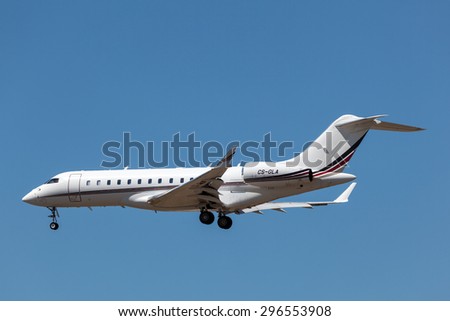 FRANKFURT MAIN - JULY 10: Bombardier Global Express business jet landing at the international airport of Frankfurt. July 10, 2015 in Frankfurt Main, Germany