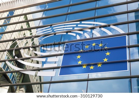 BRUSSELS, BELGIUM - AUG 21: Logo of the European Parliament at the facade of European Parliament building in Leopold Square. August 21, 2015 in Brussels, Belgium