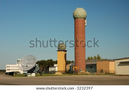 Military airport radar towers and satellite dish