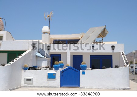 Residential white blue house on Canary Island Fuerteventura, Spain