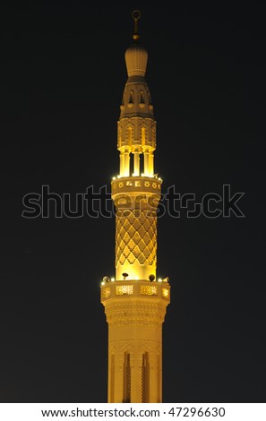 Mosque Minaret illuminated at night. Dubai, United Arab Emirates