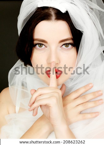 Sexy Young Woman Wearing a Wedding Veil