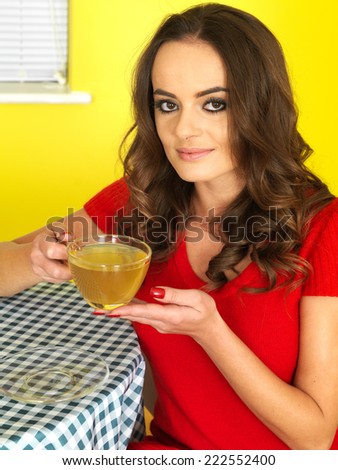 Attractive Young Woman Drinking Green Tea