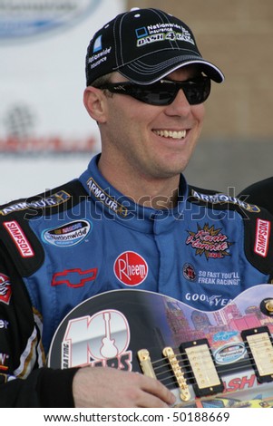 GLADEVILLE, TN - APR. 3:  Race winner Kevin Harvick with the Gibson guitar trophy in victory lane at the NASCAR Nationwide Series Nashville 300 on April 3, 2010 in Gladeville, TN