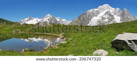 The south face of Mont Blanc (italian side), from the Vesses lake in Val Veny valley along the famous Tour du Mont Blanc trail. Courmayer, Valle d\'Aosta, Italy.