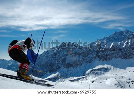 Young ski racer doing downhill slalom