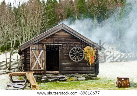 Log cabin in the wood in wintertime