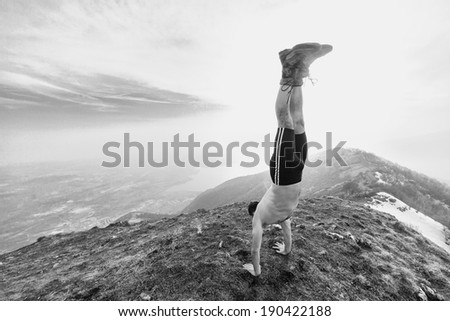 man in equilibrium in the top of the mountain