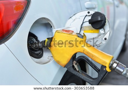 Bangkok,Thailand August 04, 2014: A Open pumping gas in to the tank