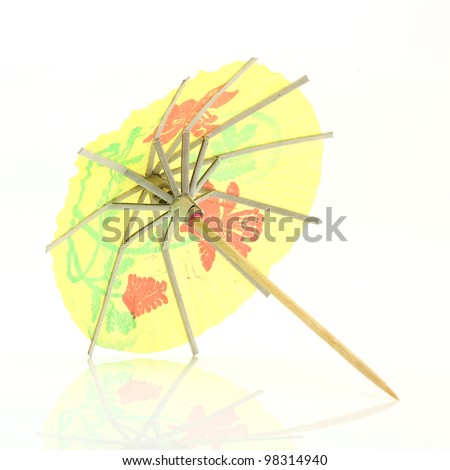 yellow cocktail umbrella isolated on white background
