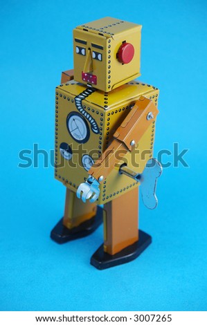 Vintage Robot toy on blue