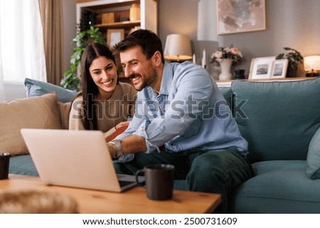 Similar – Image, Stock Photo Happy young couple drinking beverages outdoors