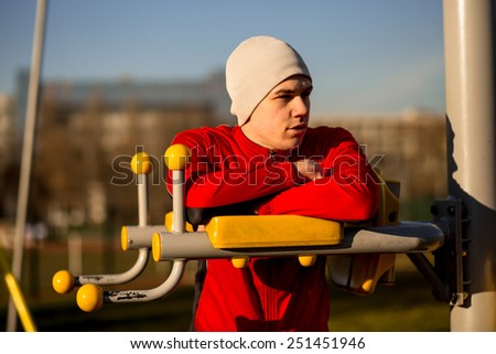 Athlete preparing for a training in an outdoor gym