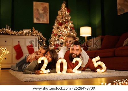 Similar – Image, Stock Photo Cheerful child having fun while playing video game at home