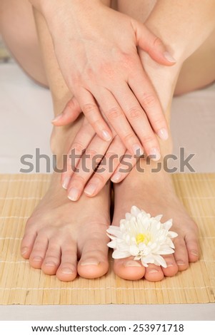 Woman\'s hands and feet after a manicure and pedicure in a nail salon