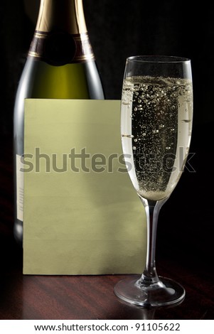 Champagne glass, bottle and wine list