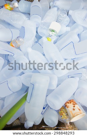 pile of plastic water bottles for recycling, junk