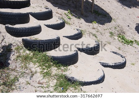staircase made from sand in the tire on the beach, recycle
