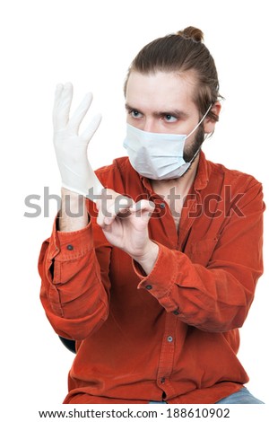 the young man dressing a medical rubber glove